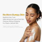 Adult demonstrating body-cleansing lather on her shoulder